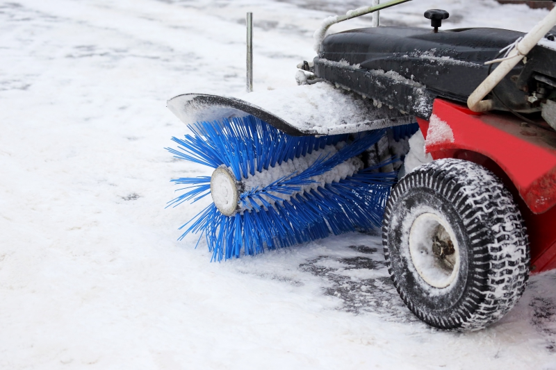 Snow brush with wheels