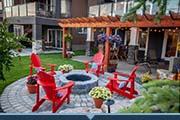 Red chairs around a firepit