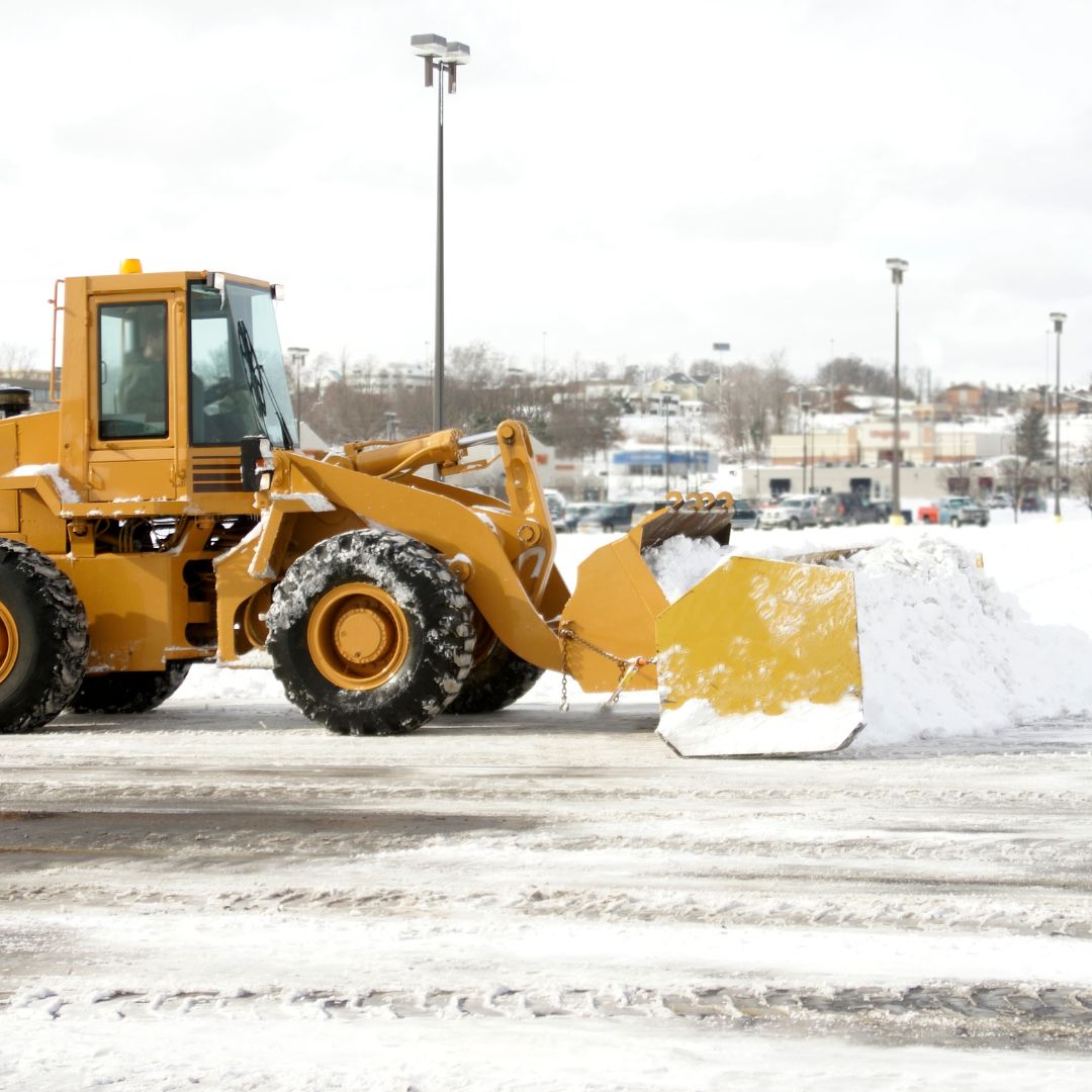 excavator moving snow