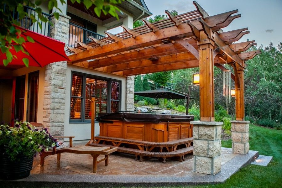 a hot tub on a stone patio