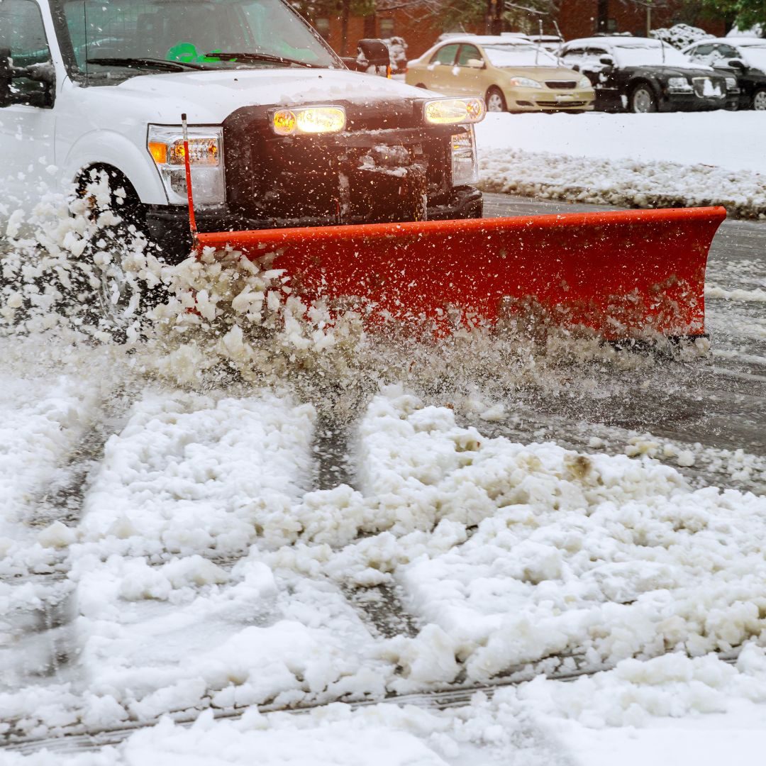 snow plow removing slushy snow